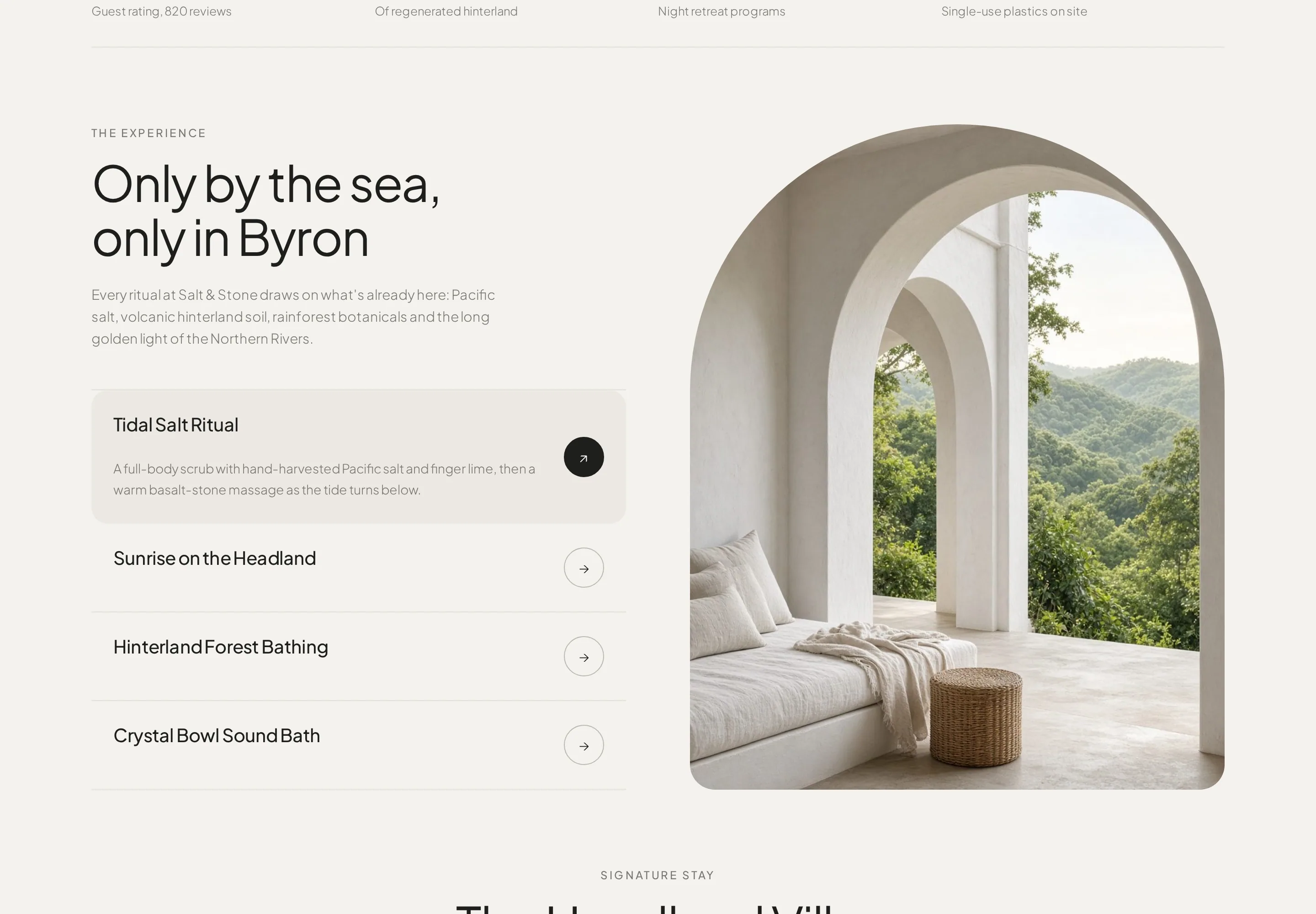 Heading 'Only by the sea, only in Byron' with intro copy and an accordion listing Tidal Salt Ritual (expanded), Sunrise on the Headland, Hinterland Forest Bathing and Crystal Bowl Sound Bath, beside a tall arch-topped photo of a white colonnade framing green hinterland hills and a linen daybed. The frame also shows the bottom of the hero section above and the top of the signature stay section below.